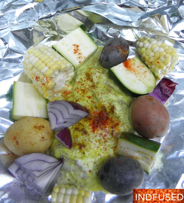 Easy recipe for Indian spiced curry chicken grilled with summer fresh veggies in aluminum foil packets.